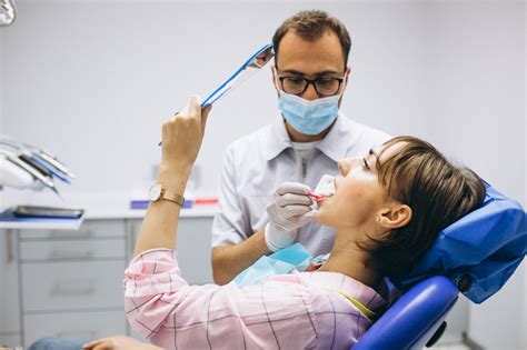 dentist stock photo|image of dentist and patient.